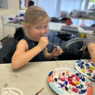 Painting clay projects after two weeks of sculpting!