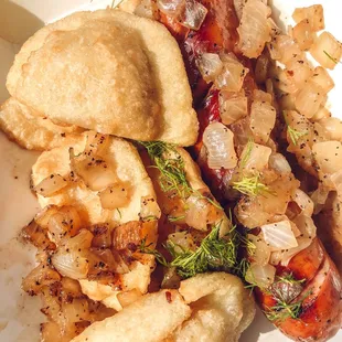 a hot dog with onions and onions