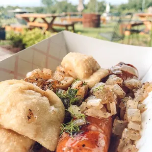 a hot dog with onions and onions