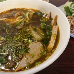 a bowl of soup and a plate of salad