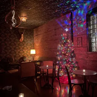 a christmas tree in a dimly lit room
