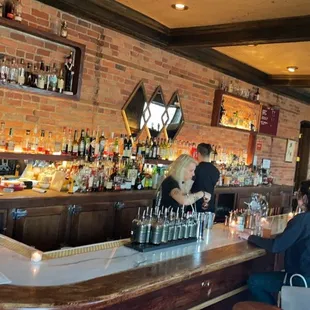people sitting at a bar