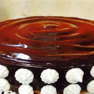 a chocolate cake with white frosting