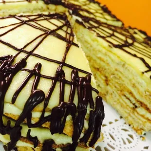 a cake with chocolate drizzle on top