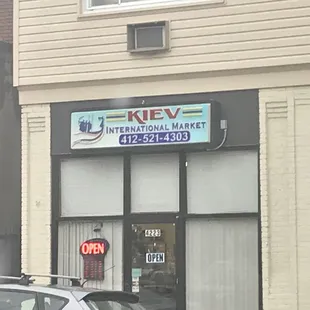 a car parked in front of a business