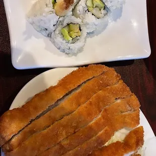 two plates of sushi on a table