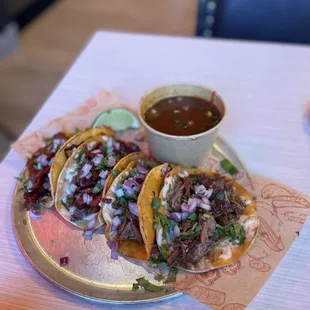 three tacoss on a plate