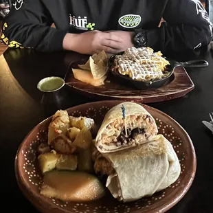 Breakfast Parilla (chorizo, potato, egg of choice, beans, sour cream, cheese) &amp; Asada Burrito (beans rice carne asada)