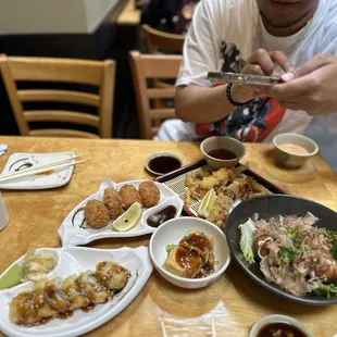 Fried tofu, fried oysters, fried California roll, soft shell crab, and takoyaki (instagram: wooneats)