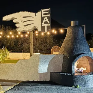 a brick oven with a fire in it