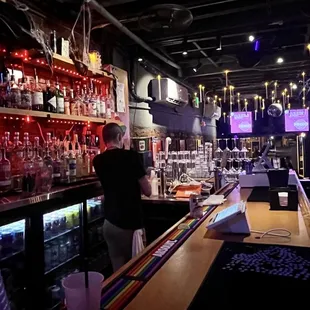 a man standing at a bar