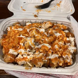 a chicken dish in a styrofoam container