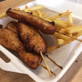 Lunch chicken sticks with rice or fries....some of the fries were already on one of the kiddos plates.