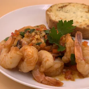 Gambas al Ajillo. Shrimp in garlic sauce with olive oil, lime, parsley, bell pepper, and chili. Kikos Cocina de Manila Take Out &amp; Delivery.