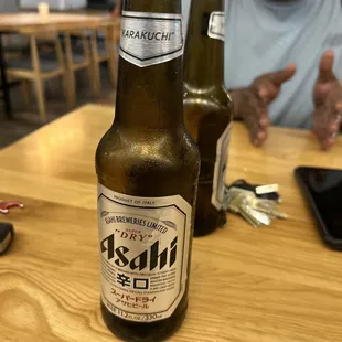 two beer bottles on a table