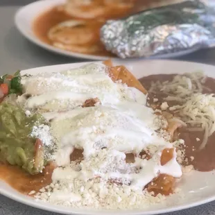 Chilaquiles (front) &amp; Huevos Rancheros (back)