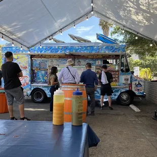 a group of people at a food truck