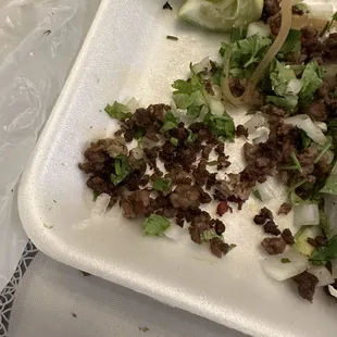 a plate of meat and vegetables