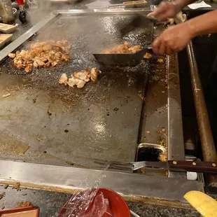 people cooking on a grill