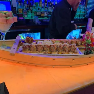 a sushi boat on a bar