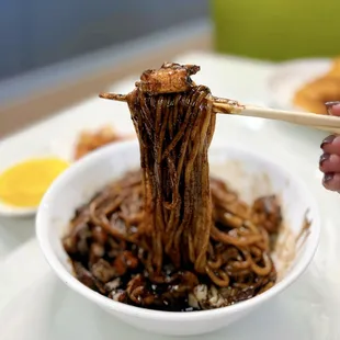 Jajangmyeon: Korean-Chinese Black Bean Noodles w/ shrimp, pork, squid, cabbage, onions | $14.99 (after mixing)