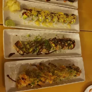 a variety of sushi on a long platter