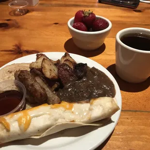 a plate of food and a cup of coffee