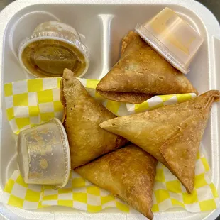 Meat samosas with sauces