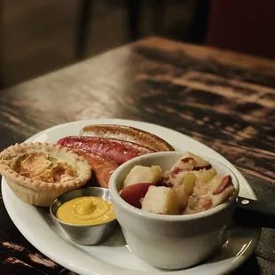 Oktoberfest sausage meal with potatoes salad and onion pie.