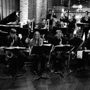 a group of musicians in a black and white photo