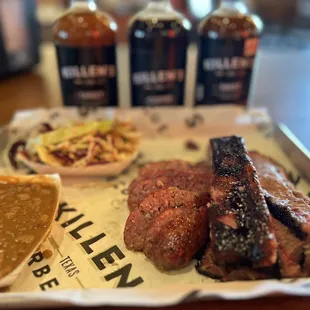 3 meat plate with Cole Slaw and Beans. Sausage, Brisket, and Ribs.