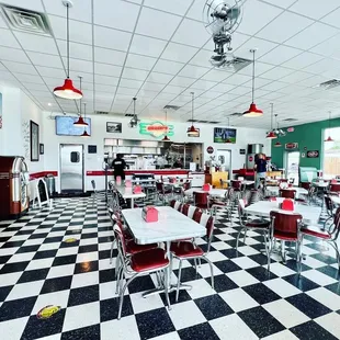 a checkered floor and diners