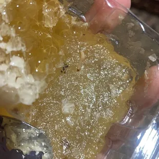 a hand holding a spoon