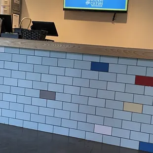 a counter with a television above it