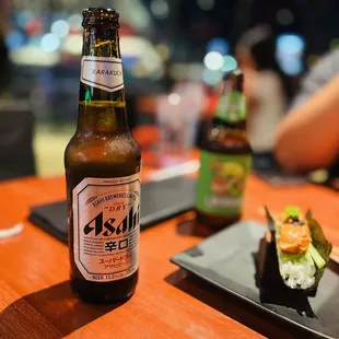 a bottle of beer and sushi