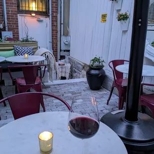 a glass of wine on a patio table