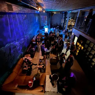 a crowd of people in a bar