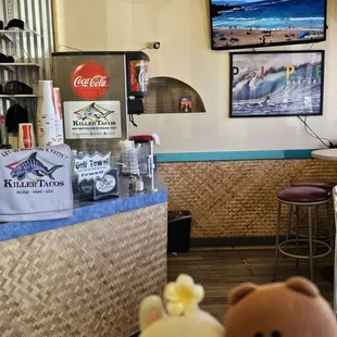 Golf towels for sale; Self-service beverage station, and big screen TV