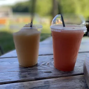 two drinks on a picnic table