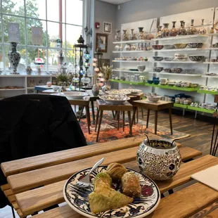 Four types of baklava and a room full of loverly pottery.