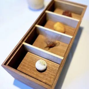 Mignardises: Hazelnut + White Chocolate, Anise Caramel, Pâte de Fruit, Sunflower Madeleine