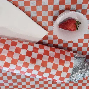 a strawberry and a wrapper