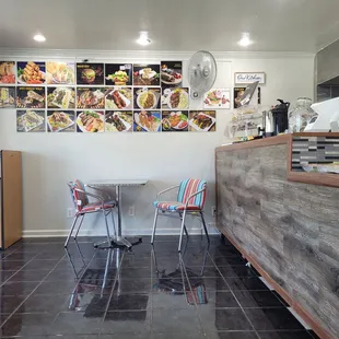 a restaurant with a counter and chairs