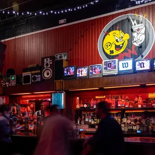 people walking around a bar