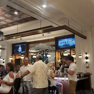 a group of people at the bar