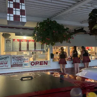 two women standing in front of a kiltie drive - in