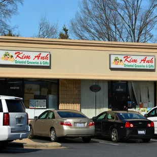cars parked in front of a restaurant