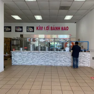 a man standing in front of a counter