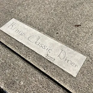 a sign on the sidewalk
