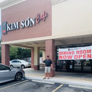 Kim Son Cafe close to Memorial City Mall. Brandon Ellis pointing to the exterior sign.